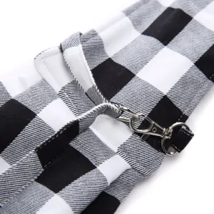 Detailed view of black and white plaid pet bag strap with metal clasp for daily outdoor use.