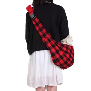 Red black buffalo plaid pet sling carrier bag back view showing adjustable strap and cozy space.