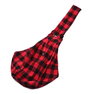 Red black plaid pet sling bag detail, breathable fabric portable puppy carrier with metal clips.
