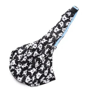 Breathable pet sling carrier, black and white dog print crossbody bag for small dogs.