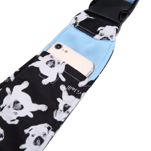 Detailed view of breathable pet sling bag strap featuring cute dog print and phone pocket.
