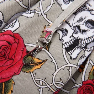 Detailed view of canvas pet bag with skull and rose print, showing durable fabric and hardware.