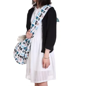 Breathable pet carrier sling bag with cute cat pattern for small dogs and cats outdoor.