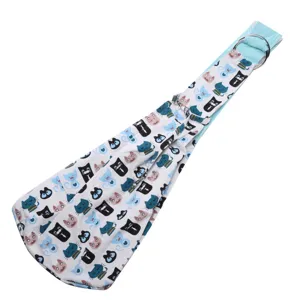 Pet sling carrier bag detail view, breathable cat print fabric with adjustable metal rings.