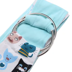 Pet sling carrier detail shot showing double metal rings and cute cat print fabric.