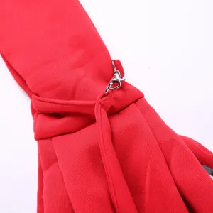 Red pet bag detail showing durable fabric strap and secure metal clasp hardware for travel.