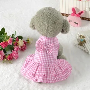Back view detail of pink gingham dog dress with a cute bow for small pets