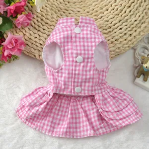 Detail view of pink and white checkered pet summer dress with white button closures