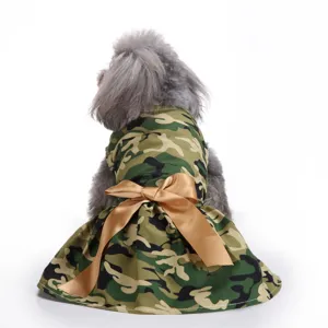 Adorable camouflage dog dress with a large golden bow detail for small pets.