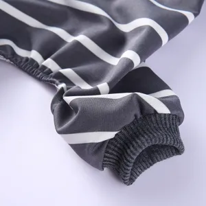 Close-up detail of striped pet clothing sleeve, showing soft fabric and ribbed cuff design.