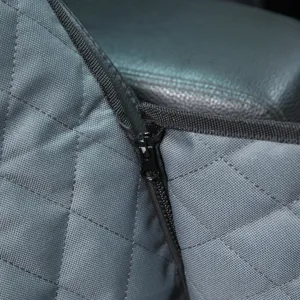 Detailed shot of gray quilted pet car seat cover zipper, waterproof fabric and durable seams.