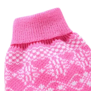 Close up of pink turtleneck pet sweater with white nordic knit pattern detail for small dogs.