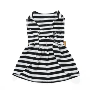 Close-up detail of black and white striped dog summer dress featuring a pleated skirt