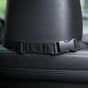 Detail shot of black nylon pet car seat strap with adjustable buckle and quick release clip.