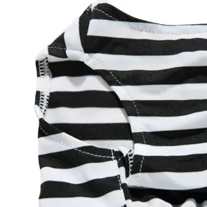 Macro detail view of black and white striped pet dress showing high-quality stitching