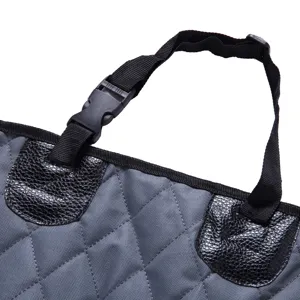 Pet car seat cover detail showing quilted grey waterproof fabric, straps and plastic buckle.