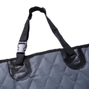 Close-up detail of pet car seat cover strap, buckle, and durable quilted waterproof fabric.