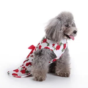 Adorable floral cotton pet dress for small dogs featuring red rose print and back bow detail