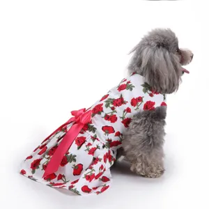 Rear view detail of white floral dog dress with red rose print and large pink bow