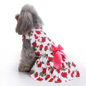 Detailed back view of pet summer dress with red rose floral print and pink bow