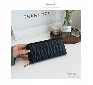 Elegante schwarz gesteppte lange Brieftasche für Damen mit goldenem Reißverschluss