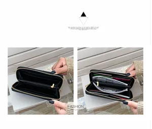 Vista detallada del interior de una cartera larga negra con textura de cocodrilo