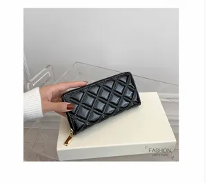 Elegant black quilted patent leather long wallet for women with gold zipper
