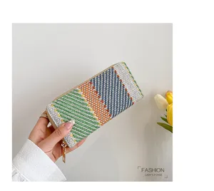 Handheld woven linen clutch bag with colorful checkered pattern and durable gold zipper