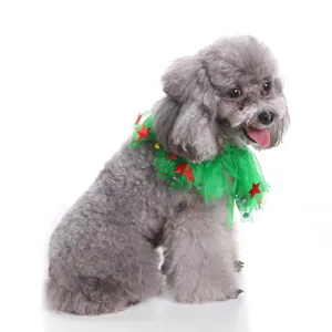 Close-up detail of a festive green tulle pet neckerchief with stars worn by a gray poodle