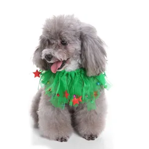 Macro view of green mesh pet Christmas collar decorated with red stars and small colorful bells