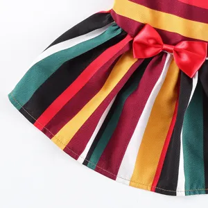 Detailed view of colorful striped pet dress with red bow, stylish summer outfit for dogs.