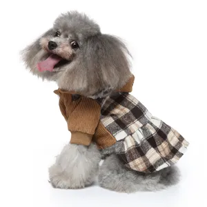 Close-up detail of brown corduroy and plaid pet dog dress for autumn and winter.