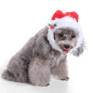 Detail view of a plush red and white Christmas pet hat featuring soft festive holly decor