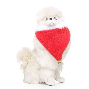 Christmas red plush pet bandana with gold bell detail on a white dog model