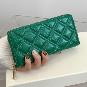 Elegant green patent leather long wallet for women featuring quilted rhombus design