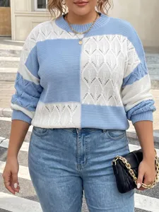 Details of the blue and white color-block knit sweater, featuring cozy long sleeves and crew neck.