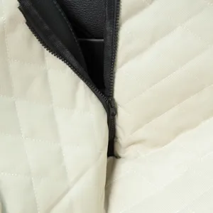 Waterproof pet car seat mat detail view, durable beige quilted fabric with black zipper.