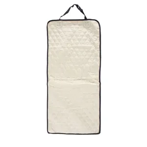 Quilted beige pet car seat mat detail, waterproof fabric with durable black binding and straps.