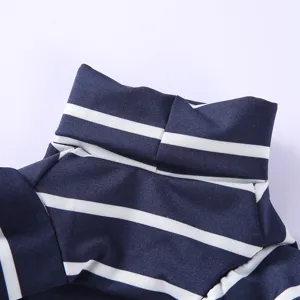 Close-up detail of the striped pet turtleneck sweater, showing clear fabric and navy blue collar.