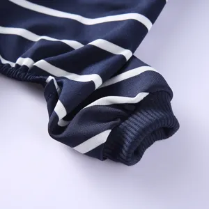 Close-up detail of striped pet clothing sleeve, soft fabric with elastic ribbed cuff.