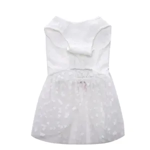 Close-up detail showing the white lace bodice and heart-patterned mesh skirt