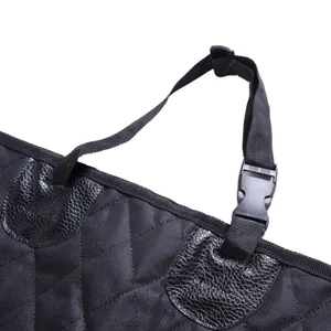 Detailed view of waterproof pet car seat cover strap, durable buckle and black quilted fabric.