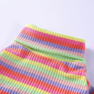 Colorful striped pet turtleneck sweater detail, cozy puppy pajamas and home clothing fabric.