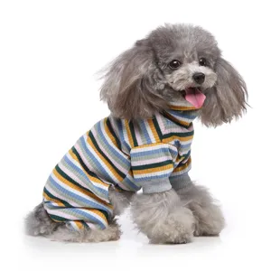 Detail shot of a cute grey poodle wearing multi-color striped turtleneck pet pajamas.