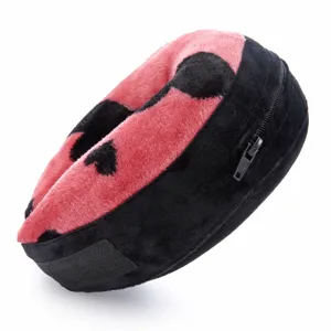 Plush pet recovery collar detail, soft pink black heart pattern, adjustable velcro strap.
