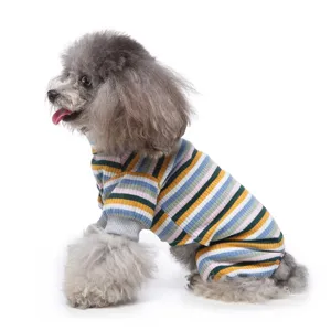 Close-up detail view of a cute dog wearing soft striped turtleneck four-leg pyjamas.