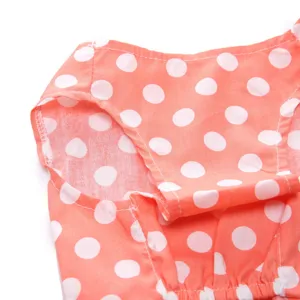 Detailed macro shot of pink polka dot pet dress showing armhole stitching quality