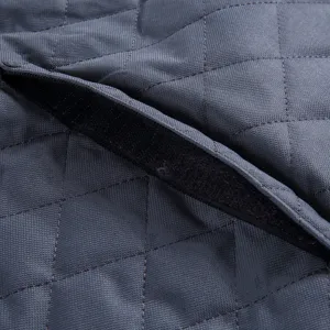 Waterproof pet car seat cover detail showing durable quilted fabric and secure velcro closure.