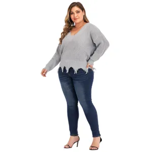 Plus size grey V-neck knitted sweater with distressed hem detail for women fashion daily wear.