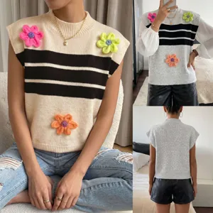 Women's knit sweater vest featuring stylish stripes and charming 3D floral appliqués.